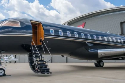 A sleek, modern private jet on a tarmac at sunset, with a couple in luxurious attire walking towards it, evoking a sense of exclusivity and freedom. The term "private jet charter" is subtly visible.