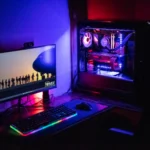 A custom-built gaming PC with vibrant RGB lighting showcasing its internal components.