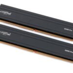 Crucial DDR5 Pro RAM sticks with low-profile heat spreaders installed on a gaming motherboard, showcasing their sleek design for gamers and creatives.