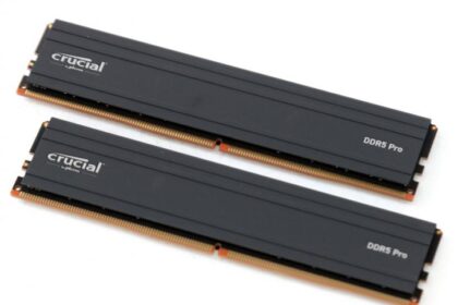 Crucial DDR5 Pro RAM sticks with low-profile heat spreaders installed on a gaming motherboard, showcasing their sleek design for gamers and creatives.