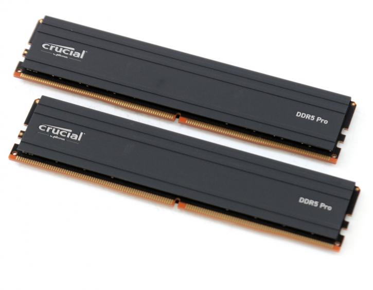 Crucial DDR5 Pro RAM sticks with low-profile heat spreaders installed on a gaming motherboard, showcasing their sleek design for gamers and creatives.